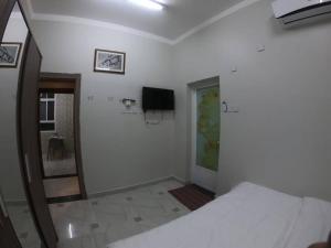 TV a/nebo společenská místnost v ubytování chalet IN