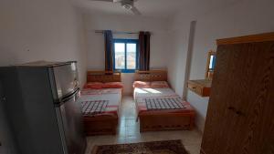 Postel nebo postele na pokoji v ubytování Anglo Chalets - Ageeba beach