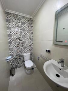 a bathroom with a toilet and a sink at Dar Diafa in Agadir