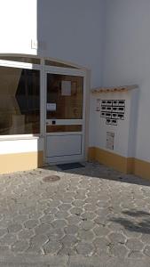 a building with a large door and a window at Zawaiaroom in Lagos