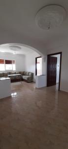 a large living room with a couch and a table at Appartements Armonía Sea View in Briech