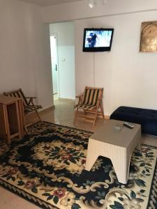 TV a/nebo společenská místnost v ubytování شاليه مكيف بقريه الأندلسيه