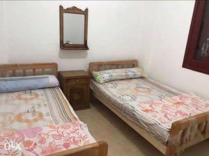 Postel nebo postele na pokoji v ubytování شاليه مكيف بقريه الأندلسيه + 28 fotografií