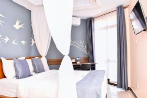 Postel nebo postele na pokoji v ubytování Divine Homes Resort Kisumu + 37 fotografií