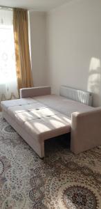 Postel nebo postele na pokoji v ubytování ЖК Алтын Шар Туран - Керей Жанибек Хандар левый берег