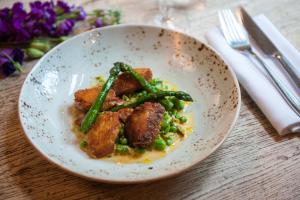 a plate of food with meat and green beans at The Canford in Poole
