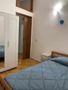 Letto o letti in una camera di Casa Vacanza Sicilia Dolce Mare