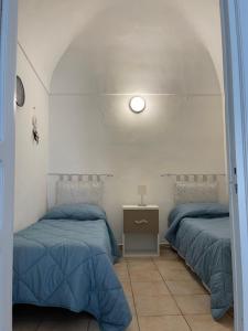 Letto o letti in una camera di Casa Vacanza Sicilia Dolce Mare