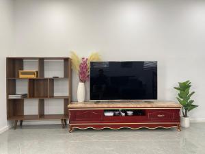 a living room with a television on top of a table at Blue Haven Retreat - Beverly Hills 208 in Sydney