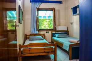Postel nebo postele na pokoji v ubytování Platamon village house