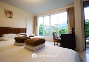 Ένα ή περισσότερα κρεβάτια σε δωμάτιο στο Ao Nang Mountain View Pool Villa +34 φωτογραφίες
