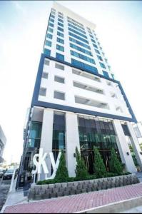 a tall building with a sign on the side of it at Sky homestay in Kota Kinabalu