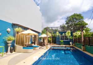 a villa with a swimming pool and a house at Ao Nang Mountain View Pool Villa in Ao Nang Beach