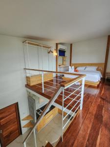 a room with a desk and a bed in a room at Haadson Resort & Koh Raham in Haad Son