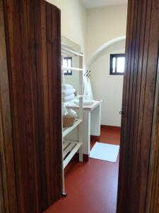 a bathroom with a white sink and a mirror at Quinta do Passal in Arega