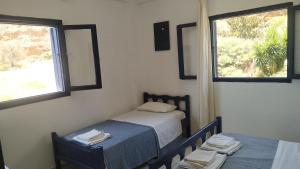 Postel nebo postele na pokoji v ubytování Georgoshouse Lykos beach Sfakia + 37 fotografií