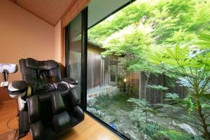 a large window in a room with a fish tank at Yumoto Ueyama Ryokan in Himeji