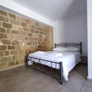 Ein Bett oder Betten in einem Zimmer der Unterkunft Rhodes Youth Hostel