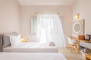 Postel nebo postele na pokoji v ubytování Satori Boutique Hotel
