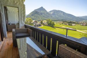 a balcony with a view of the mountains at Wolfgangsee Appartements in Strobl