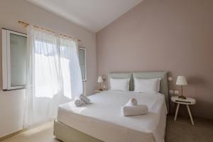 Postel nebo postele na pokoji v ubytování Satori Boutique Hotel