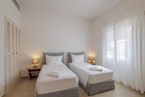 Postel nebo postele na pokoji v ubytování Satori Boutique Hotel