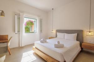 Postel nebo postele na pokoji v ubytování Satori Boutique Hotel