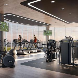 a gym with two women on treadmills in a gym at Exec Oasis @Ellipse in Midrand