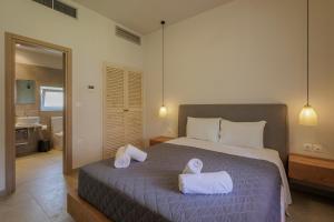 Postel nebo postele na pokoji v ubytování Satori Boutique Hotel