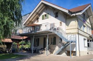 a building with a staircase on the side of it at Mountain Holiday in Wimmis