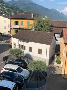 a group of cars parked in front of a building at Casetta ticinese nel nucleo in Minusio