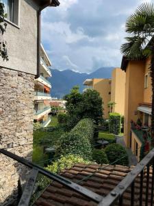 a view of a stairway in a city with buildings at Casetta ticinese nel nucleo in Minusio