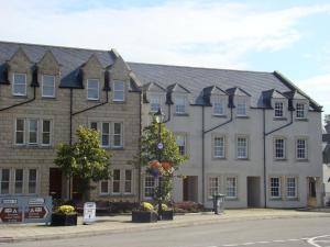 a large building on the side of a street at The Town House in Dornoch