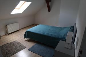 Llit o llits en una habitació de Colmar charmant logement