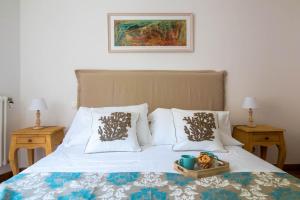 Postel nebo postele na pokoji v ubytování Elios by PortofinoHomes