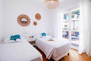 Postel nebo postele na pokoji v ubytování Elios by PortofinoHomes