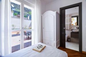 Postel nebo postele na pokoji v ubytování Elios by PortofinoHomes
