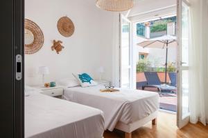 Postel nebo postele na pokoji v ubytování Elios by PortofinoHomes