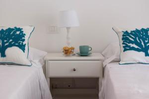 Postel nebo postele na pokoji v ubytování Elios by PortofinoHomes