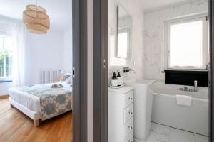 Postel nebo postele na pokoji v ubytování Elios by PortofinoHomes