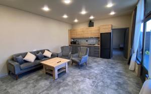 a living room with a couch and a table at Mughni Family House in Ashtarak