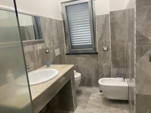 Kúpeľňa v ubytovaní Akoya Rooms Capo Vaticano