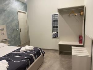 Posteľ alebo postele v izbe v ubytovaní Akoya Rooms Capo Vaticano