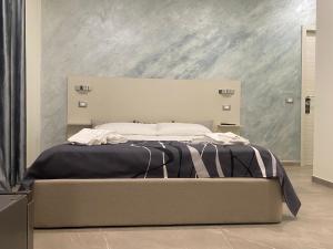 Posteľ alebo postele v izbe v ubytovaní Akoya Rooms Capo Vaticano