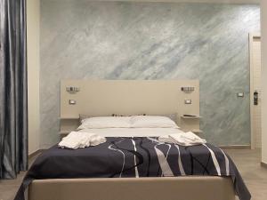 Posteľ alebo postele v izbe v ubytovaní Akoya Rooms Capo Vaticano