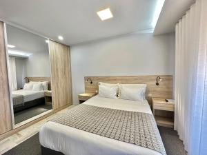 En eller flere senge i et værelse på YOUROPO - Downtown