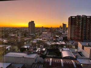 a view of a city at sunset at Departamento Rivadavia in Santa Rosa