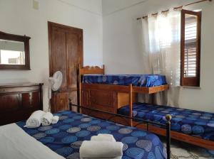 Postel nebo postele na pokoji v ubytování BAGLIO MULINO