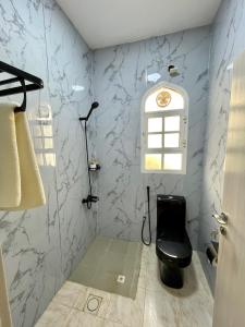 Een badkamer bij Deluxe Apartment
