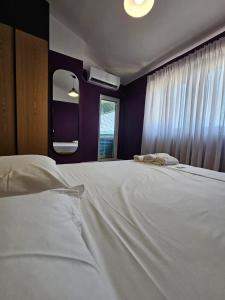 Ένα ή περισσότερα κρεβάτια σε δωμάτιο στο Drion Apartment with lake view